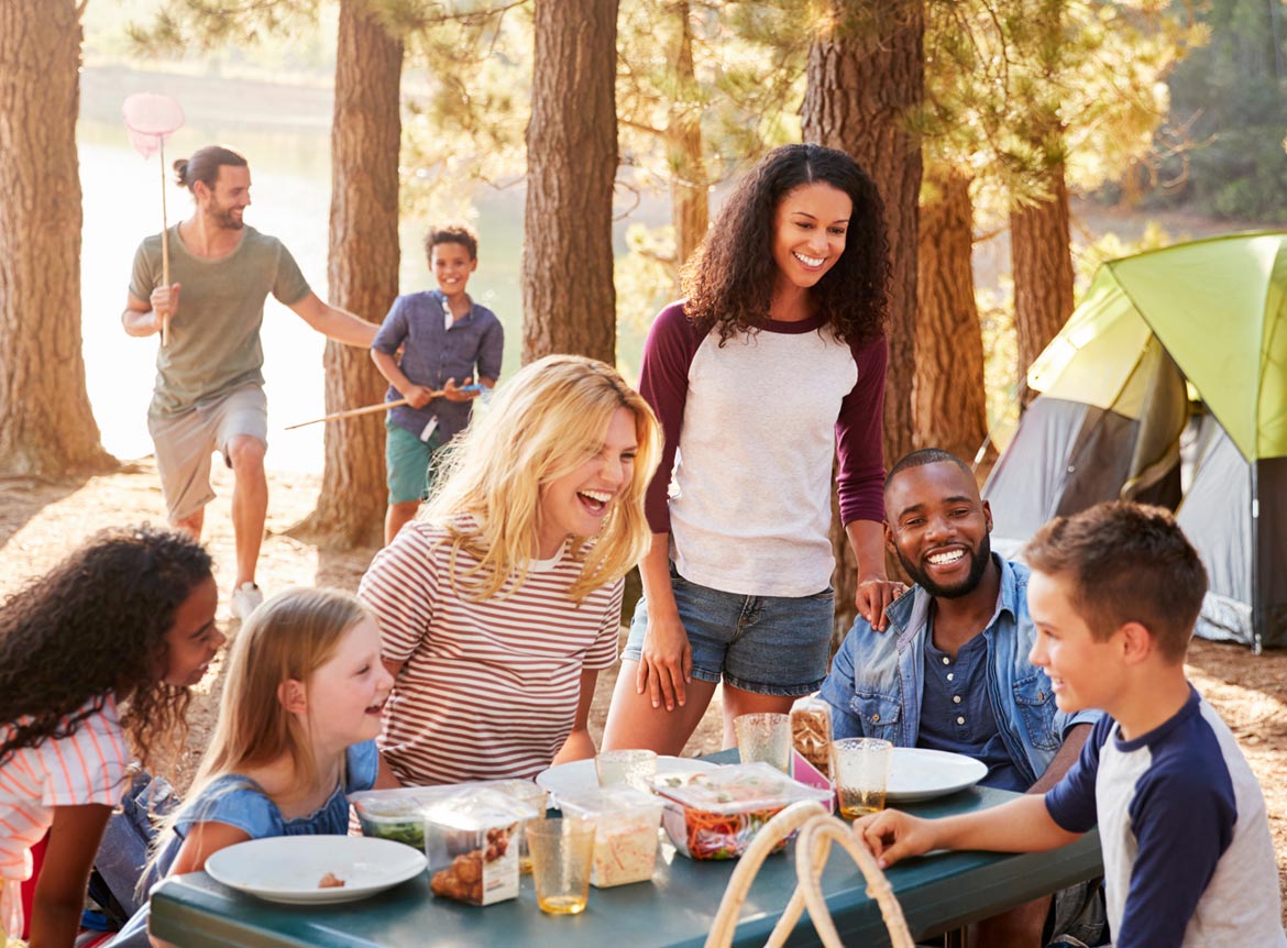 Friends and family having fun camping.